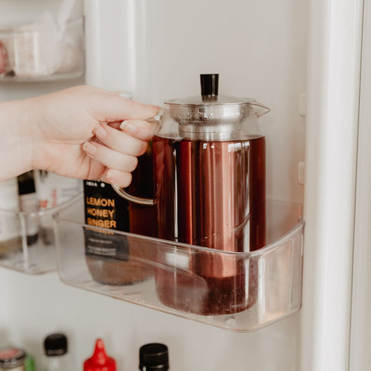 Teapot of iced tea in fridge